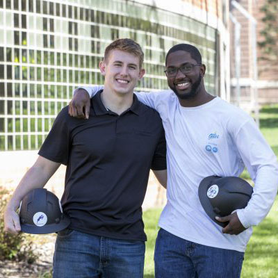 Zach Yankovich ՚19 (left) and Milton Spradley ՚19 in front of the Small Multi-Sport Center