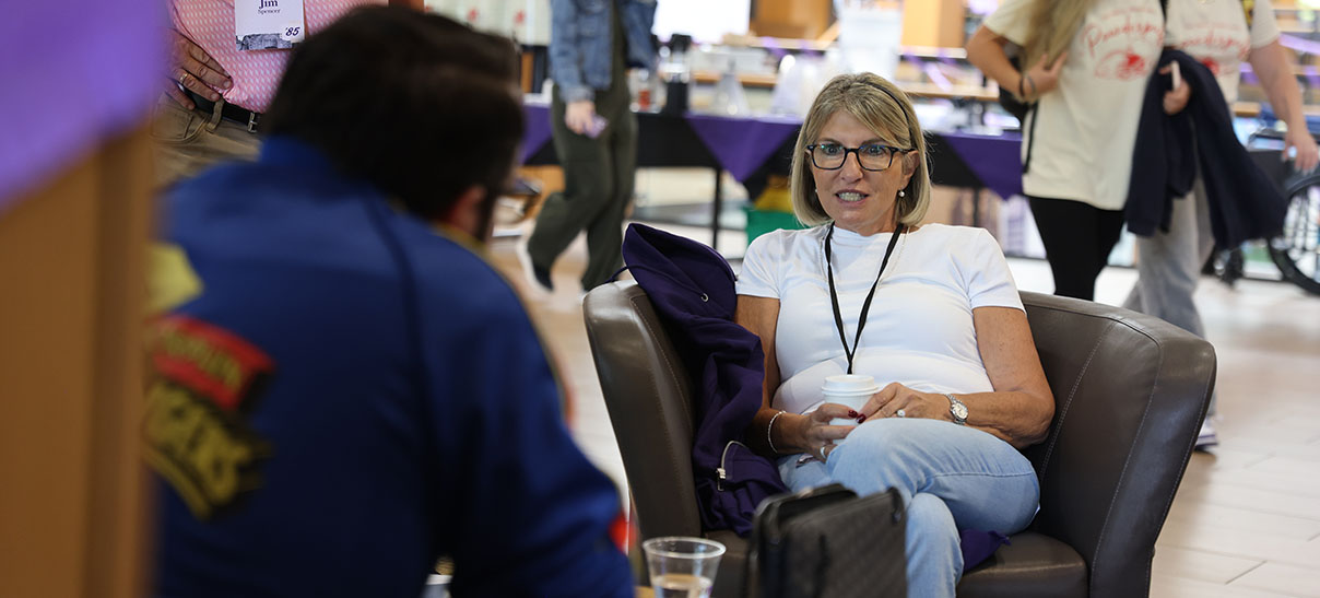 Cornell alumna in a discussion in Thomas Commons at Homecoming